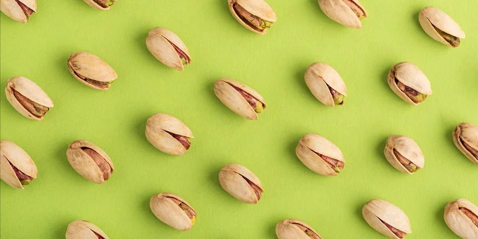 Pistachio Nuts Pattern on Green Background 写真素材