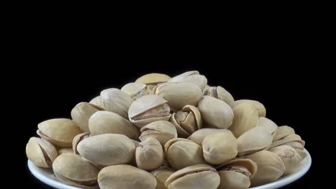 Pistachio nuts on a plate Stock Footage 160895361