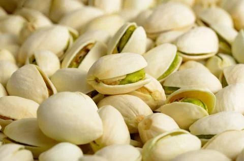 Pistachio nuts in shell as background. Texture Stock Photos