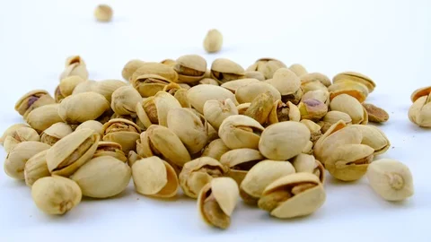 Pistachio nuts on a white background Stock Footage 123835542