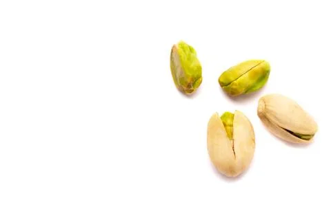 Pistachio nuts on a white background Stock Photos
