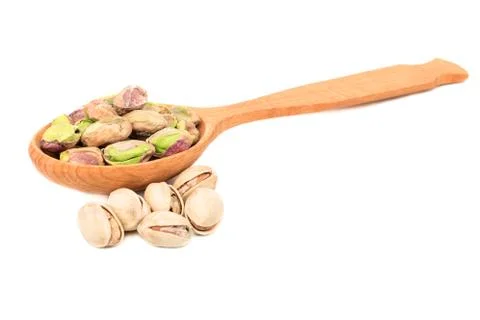 Pistachio nuts without shell in spoon Stock Photos
