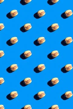 Pistachio pattern on blue background, colorful flat lay food texture top view Stock Photos