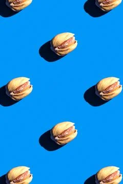 Pistachio pattern on blue background, colorful flat lay food texture top view Stock Photos
