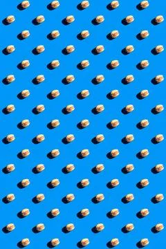 Pistachio pattern on blue background, colorful flat lay food texture top view Stock Photos