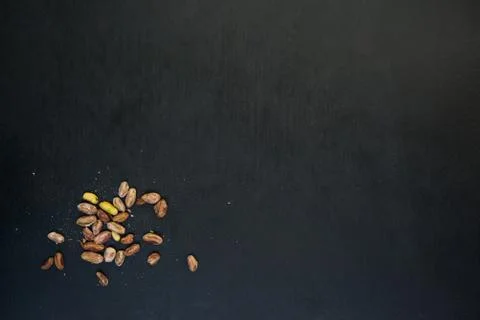 Pistachios on black slate table Stock Photos