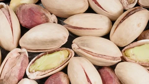 Pistachios close-up. Lots of nuts. Nuts in the peel. Nut kernels. 스톡 동영상 141338598