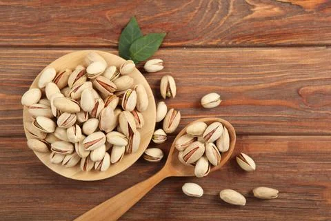 Pistachios close-up on the table Photos