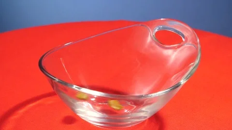Pistachios falling into a bowl Stock Footage 112648769