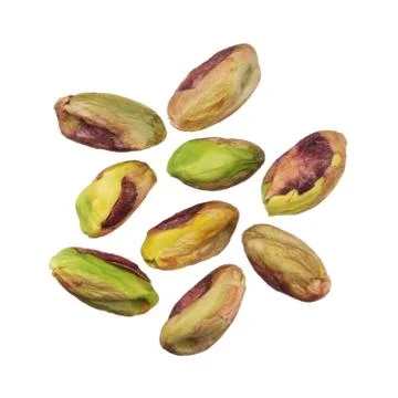 Pistachios nuts without shells isolated on white background, close up Stock Photos