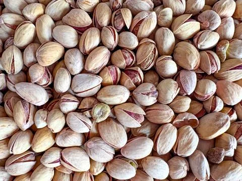 Pistachios photographed from an upper angle. Flat layout with pistachios. Stock Photos