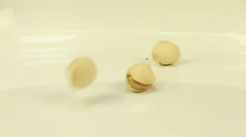 Pistachios piled on a white dish Stock Footage 47892558