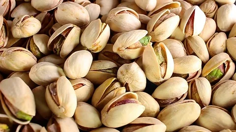 Pistachios pistachio nuts nut food closeup texture pattern seamless looping Video stock 102742653