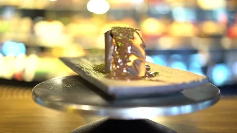 Pistachios on a slice of chocolate cake Stock Footage 167588870