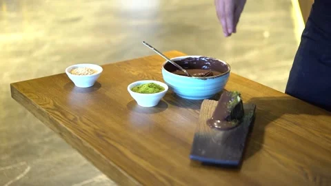 Pistachios on a slice of chocolate cake Stock Footage 167588929