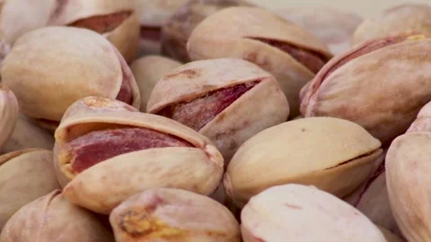 Pistachios spinning slowly on the table Stock Footage 338160560