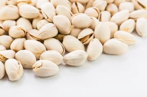 Pistachios on white background isolate Stock Photos