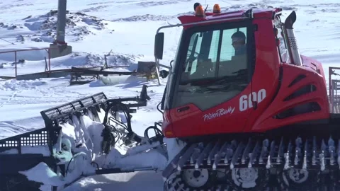 Pistenbully approaching camera and parking Stock Footage 144065635
