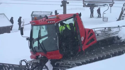 Pistenbully operator entering the cab Stock Footage 144065582
