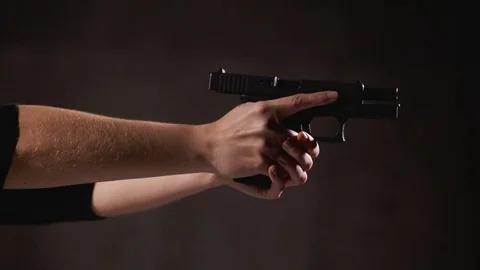 Pistol Action Sliding Forward. Ready to Fire with Propper Trigger Stock Footage 121061894