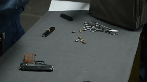 Pistol and bullets on the table 库存影片 62447407