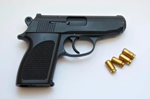 Pistol with bullets Stock Photos