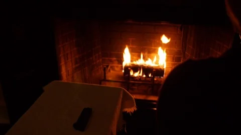 Pistol loaded by firelight and aimed at a fireplace - two-clip sequence HD Stock Footage 96355116