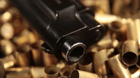Pistol Pietro Beretta on Shells, Macro Dolly Detail Graphic Background Stock Footage 55317552