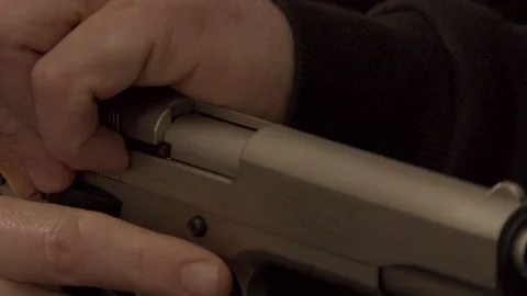 Pistol slide being pulled back in slow motion Video stock 149210537