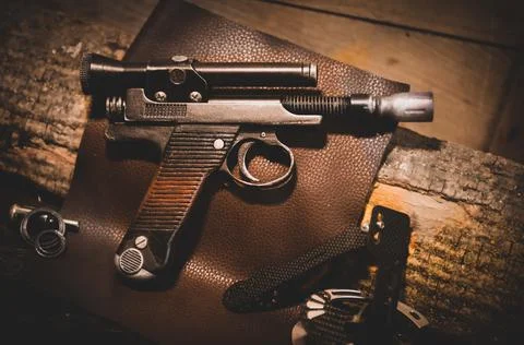 Pistol on table Stock Photos