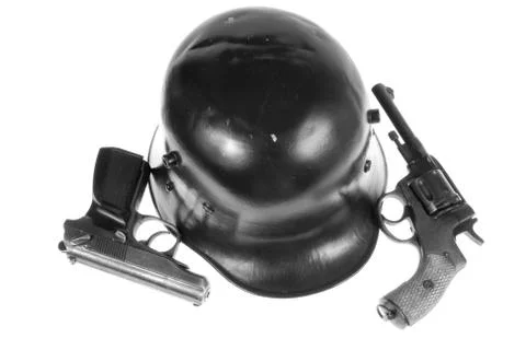 Pistols and helmet Stock Photos