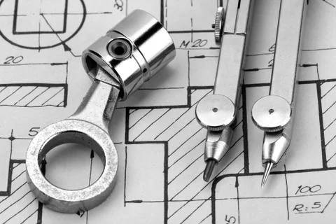 Piston on engineering design paper Stock Photos