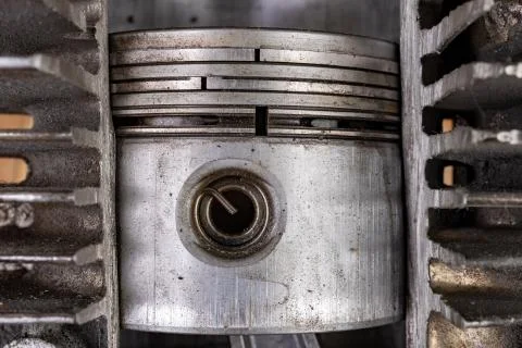 Piston of an internal combustion engine in a cut aluminum cylinder. Internal  Stock Photos