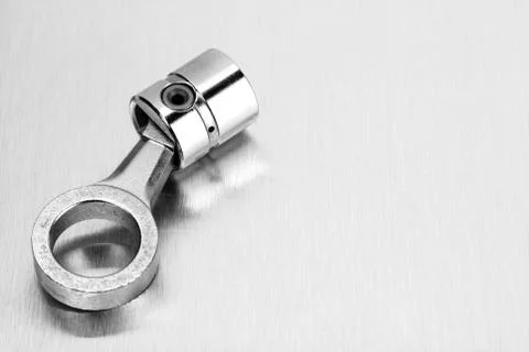 Piston on steel surface Stock Photos