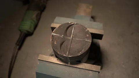 Piston in a vise 004 Stock Footage 144307491