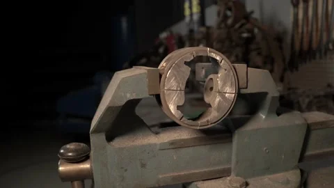 Piston in a vise 007 Stock Footage 144307510