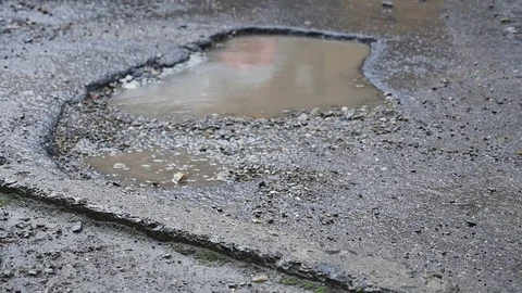Pit and puddle in the asphalt Stock Footage 78362219