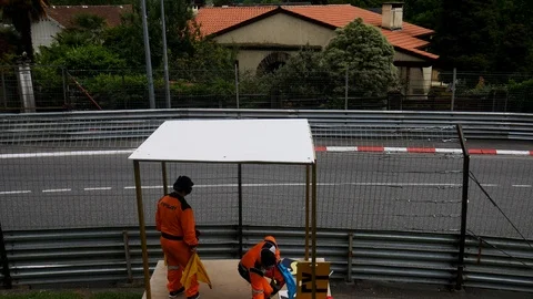 Pit crew waving flags at race car drivers Stock Footage 108834434