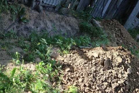 Pit dug for technical and electrical equipment Stock Photos