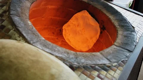 Pita Bread, Arabian Bread, Syrian Bread, Indian Flat Bread in Tandoor Stock Footage 172558320