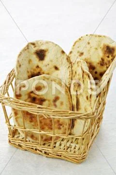 Pita bread in a basket Stock Photos