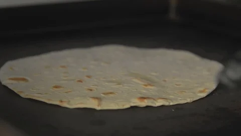 Pita bread fried in a pan Stock Footage 102510584