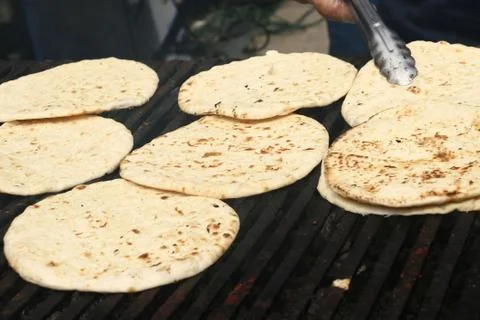 Pita bread on grill Stock Photos