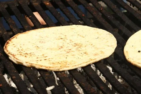 Pita bread on grill Stock Photos
