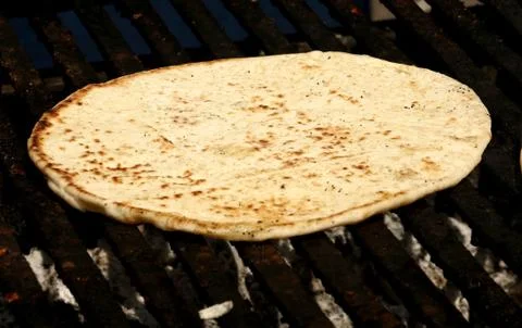 Pita bread on grill Stock Photos
