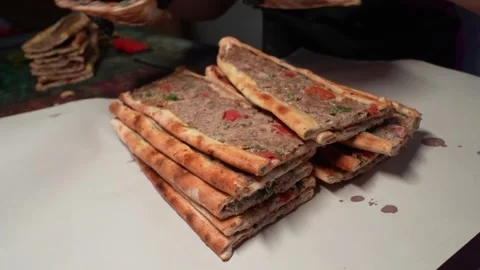 A pita bread master packaging fresh pita bread at a traditional pita restaurant. Stock Footage 323182905