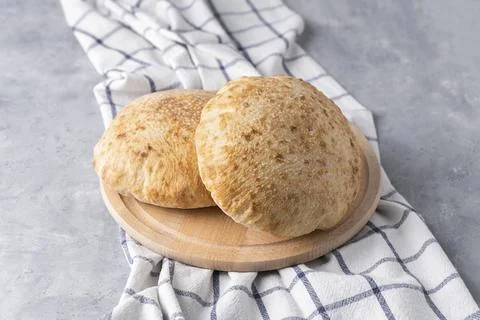 Pita bread on neutral background. Arabic traditional food Stock Photos