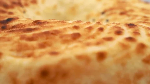 Pita bread rotates on a white background. 4k Video stock 117637127