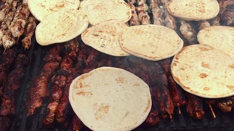 Pita Bread Turned Over on Top of Shishkebab Stock Footage 76940863