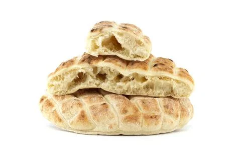 Pita flat-bread toasted of a grid pattern over white Stack of round pita f... Stock Photos